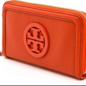 Tory Burch Zip around wallet, orange pebbled leather in excellent condition!